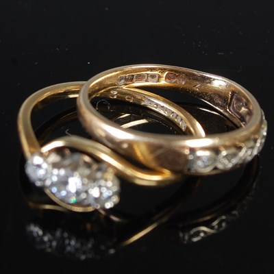 Lot 69 - A group of four yellow metal rings to include...