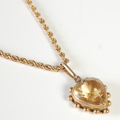 Lot 72 - A yellow metal mounted heart shaped citrine...