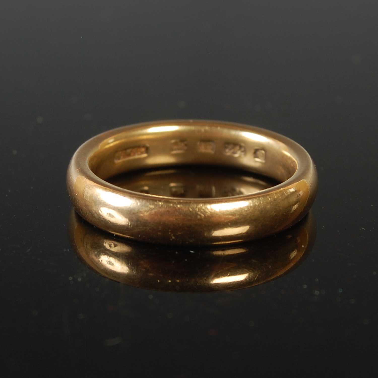 Lot 73 - A 22ct gold wedding ring, size M, 7 grams.