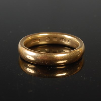 Lot 73 - A 22ct gold wedding ring, size M, 7 grams.