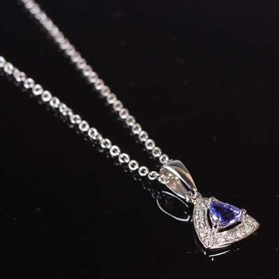 Lot 78 - An 18ct white gold, tanzanite and diamond set...