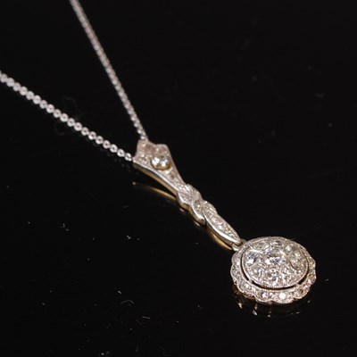 Lot 79 - A yellow and white metal diamond set pendant...