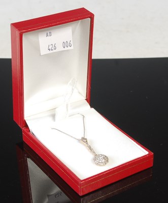 Lot 79 - A yellow and white metal diamond set pendant...