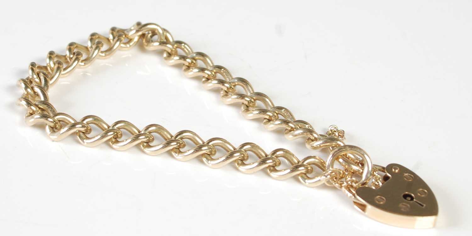 Lot 84 - A 9ct gold bracelet with 9ct gold heart shaped...