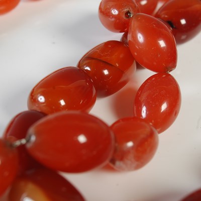 Lot 97 - Two polished agate bead necklaces.
