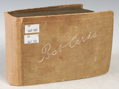 Lot 100 - A vintage postcard album, inscribed the the...