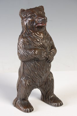 Lot 106 - A bronzed spelter moneybox in the form of a...