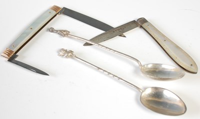 Lot 166 - Two novelty silver teaspoons, one with imp...
