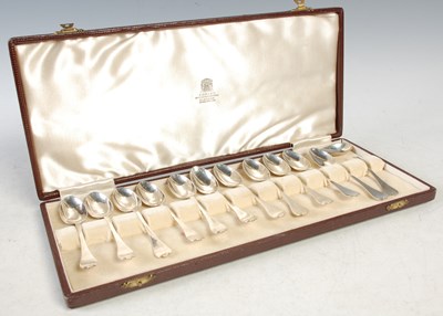 Lot 198 - A cased set of twelve London silver trefid end...