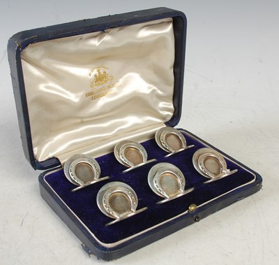 Lot 199 - A cased set of six Edwardian silver menu card...