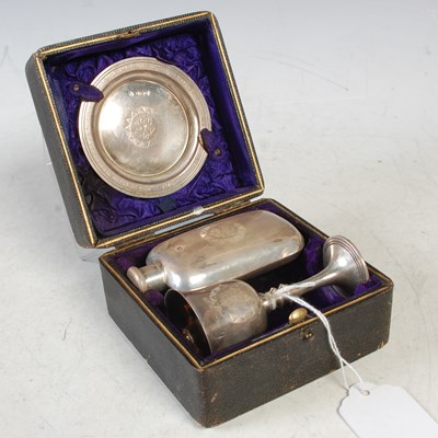 Lot 209 - An Edwardian silver cased travelling communion...
