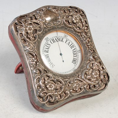 Lot 214 - A pocket barometer in silver overlaid case...