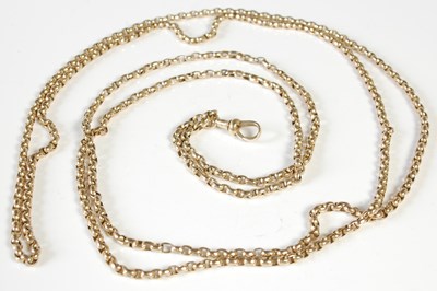 Lot 218 - A long yellow metal guard chain, stamped '9',...