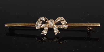 Lot 239 - A white and yellow metal diamond chip brooch...