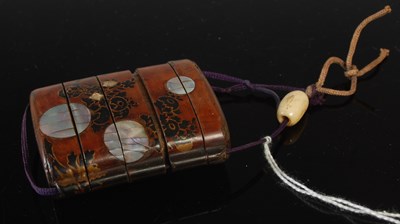Lot 293 - A Japanese lacquer and mother-of-pearl inlaid...