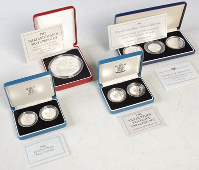 Lot 302 - Four Royal Mint cased silver proof coins to...