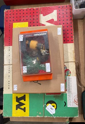 Lot 320 - A vintage box of Meccano; together with two...