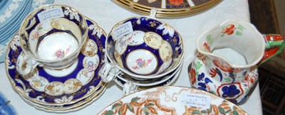 Lot 313 - Three Victorian hand-painted cups and saucers,...