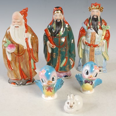 Lot 414 - Three assorted Chinese porcelain figures; a...