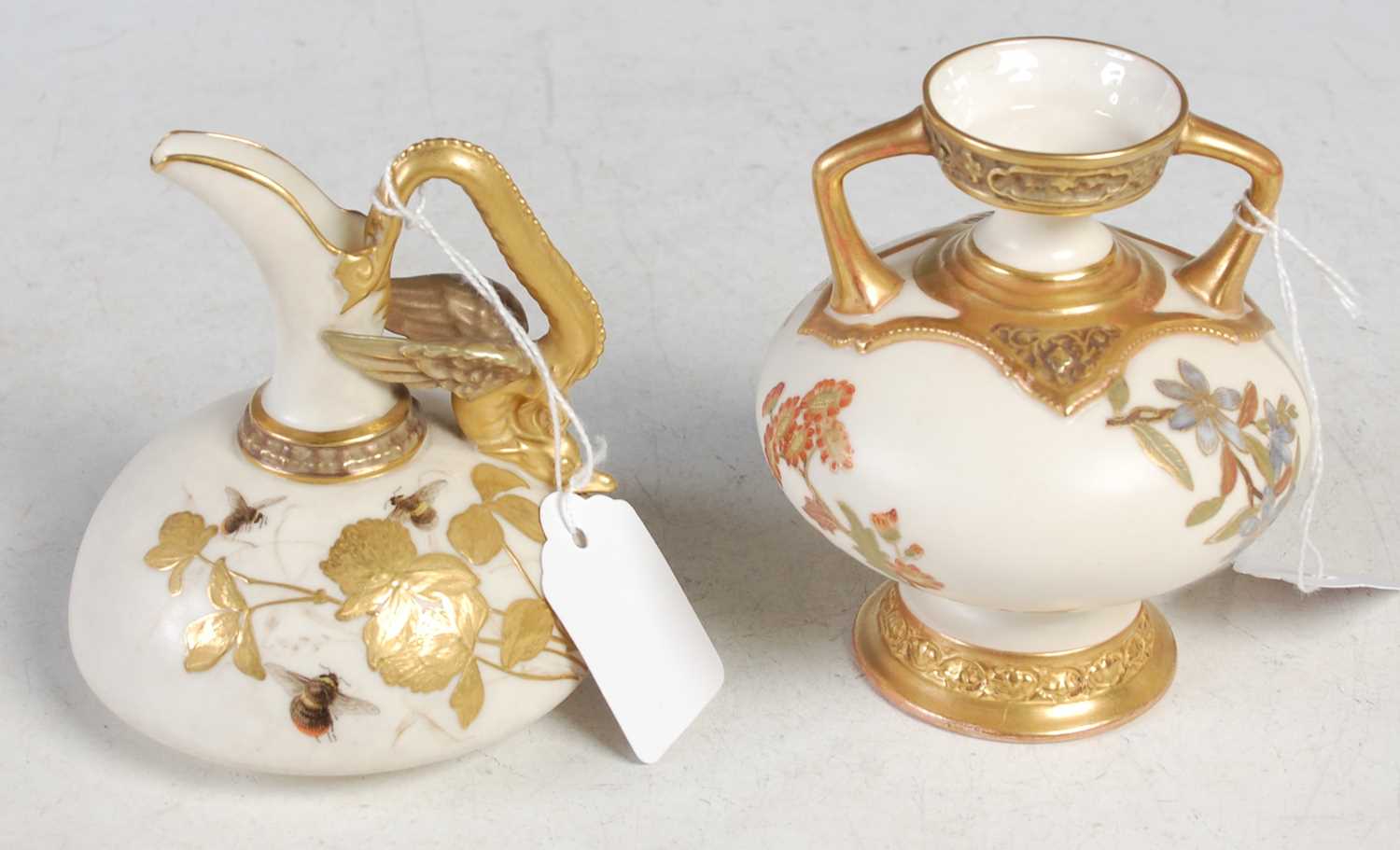 Lot 419 - A Royal Worcester ivory ground twin handled...
