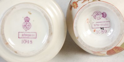 Lot 419 - A Royal Worcester ivory ground twin handled...