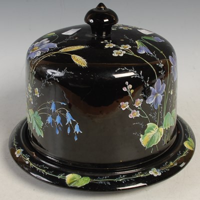Lot 440 - A Victorian black ground pottery cheese bell...