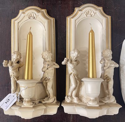 Lot 474 - A pair of composite wall mounted candle...