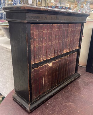 Lot 501 - A table top painted pine bookcase, the frieze...