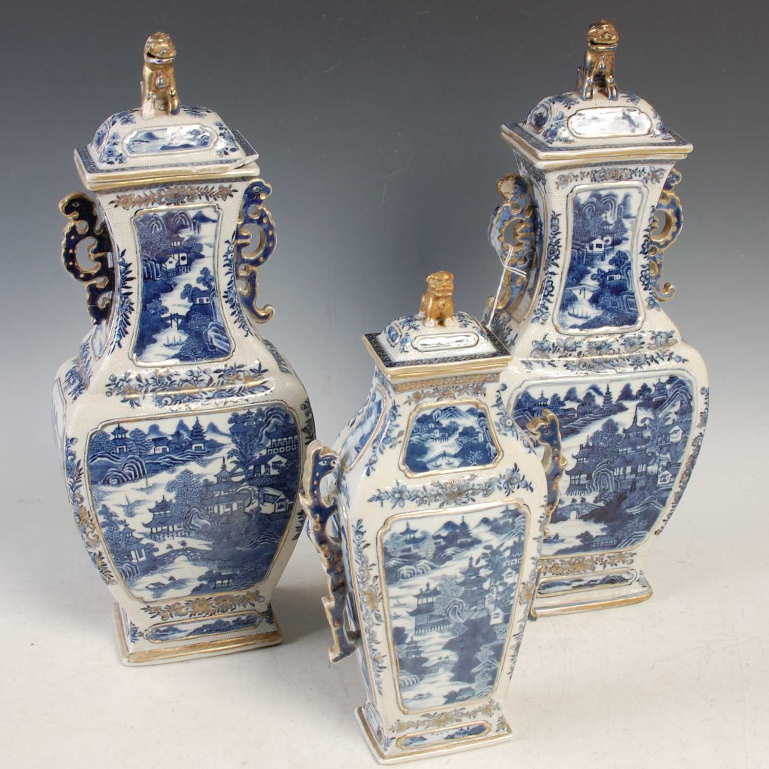 Lot 506 - A garniture of three Chinese porcelain blue...