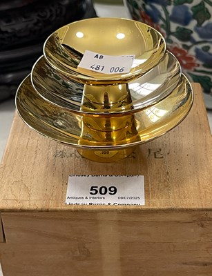 Lot 509 - A boxed set of three Japanese yellow metal...