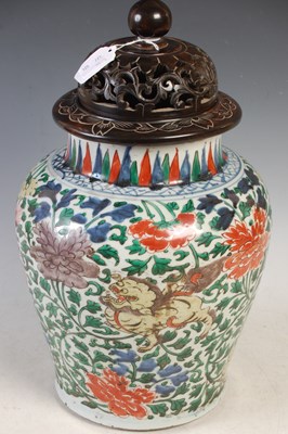 Lot 510 - A Chinese porcelain Wucai jar and wood cover,...