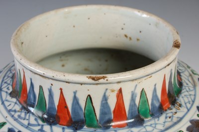 Lot 510 - A Chinese porcelain Wucai jar and wood cover,...