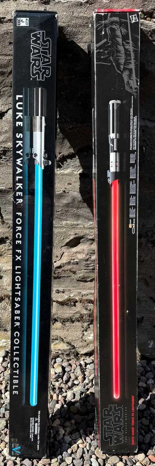 Lot 596 - Two Force FX Lightsabers comprising Darth...