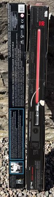 Lot 596 - Two Force FX Lightsabers comprising Darth...