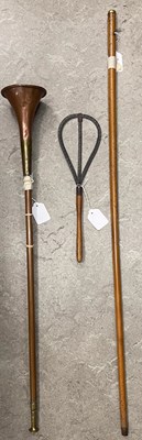 Lot 632 - A yellow metal mounted Malacca cane; a copper...