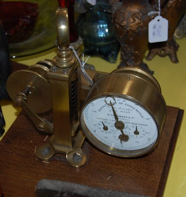 Lot 358 - A brass scientific instrument mounted on a...