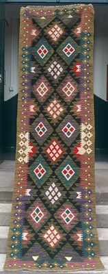 Lot 870 - A black ground Maimana kilim runner, with...
