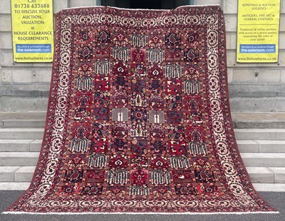 Lot 884 - A Persian Bakhtiari garden pattern carpet, the...