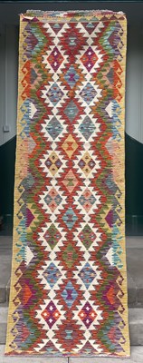 Lot 869 - A Chobi kilim runner, the ivory ground...