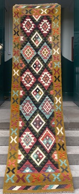 Lot 871 - A Maiman kilim runner, the black ground...