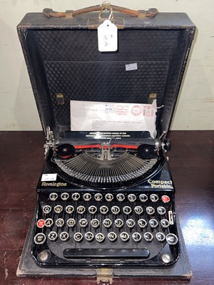 Lot 730 - A vintage Remington Compact Portable typewriter.