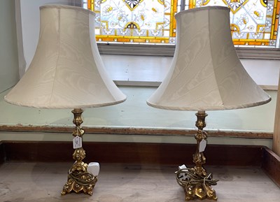 Lot 731 - A pair of gilt composite table lamps and...