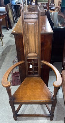 Lot 753 - An early 20th century oak Caquetoire armchair,...