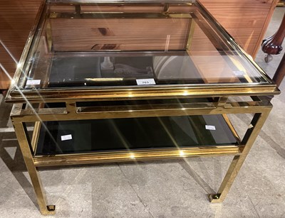 Lot 763 - A 20th century brass and glass two tier square...