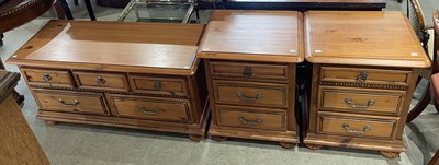 Lot 774 - A pair of pine three drawer bedside chests,...