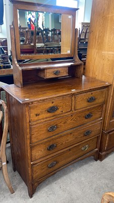 Lot 783 - An early 20th century ash mirror back dressing...