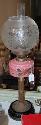 Lot 340 - A Victorian paraffin lamp with pink glass font...