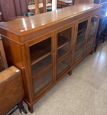 Lot 820 - An early 20th century mahogany bookcase, with...