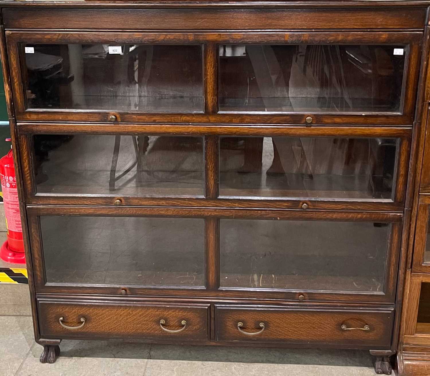 Lot 822 - A four sectional stacking bookcase comprising...