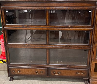 Lot 822 - A four sectional stacking bookcase comprising...